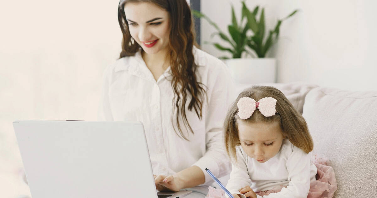 Woman with child working from home