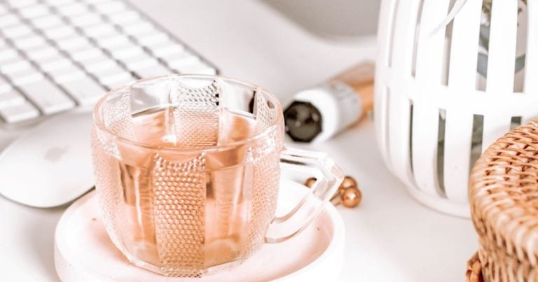 Desk with keyboard, mouse, and coffee for working from home