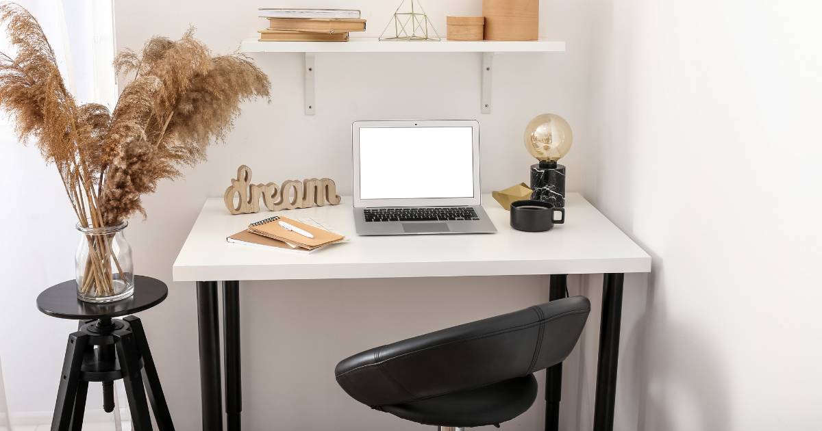 Home office with desk, chair, and laptop