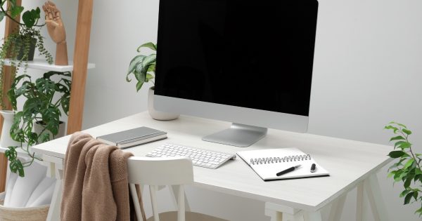 Home office with desk, computer, and chair