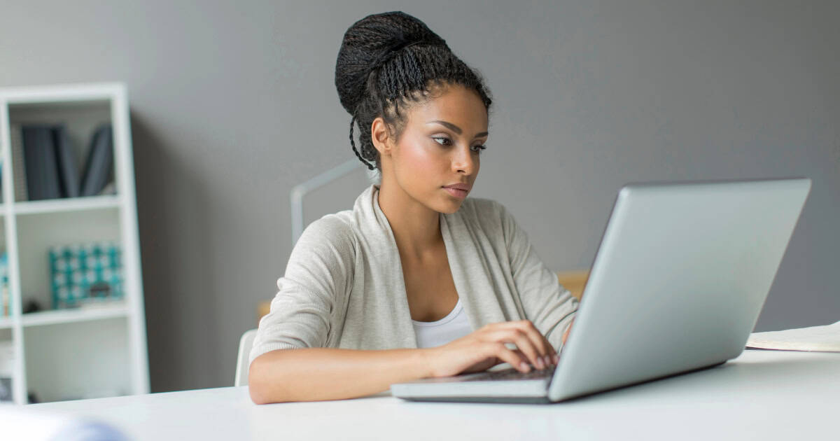 Woman working on a laptop from home