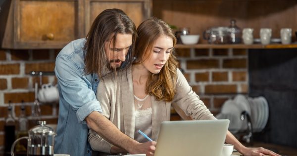 Man and woman working together on a computer