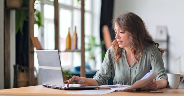 Woman working on a laptop at home